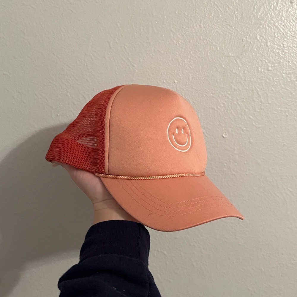 smiley face orange trucker hat